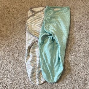 2 SwaddleMe swaddle sleep sacks. Size large. Excellent used condition.